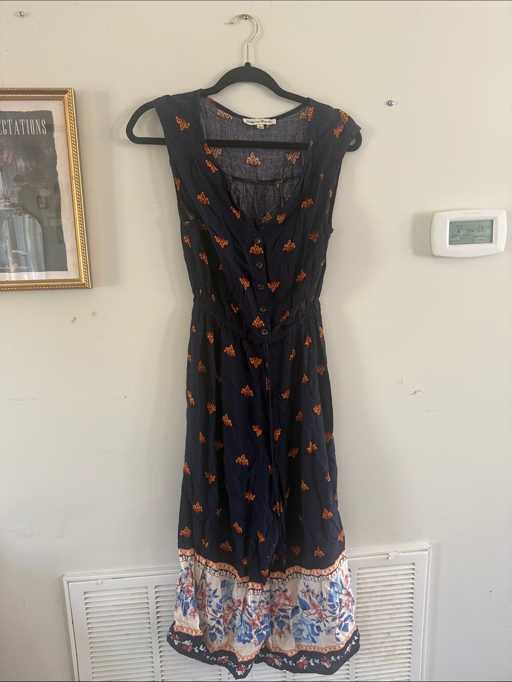 Sleeveless Navy Maxi Dress with Orange Floral Motif and Border Hem